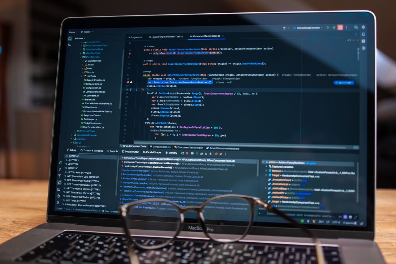 Unit tests running in a code editor on a laptop, with the test explorer and test output visible.